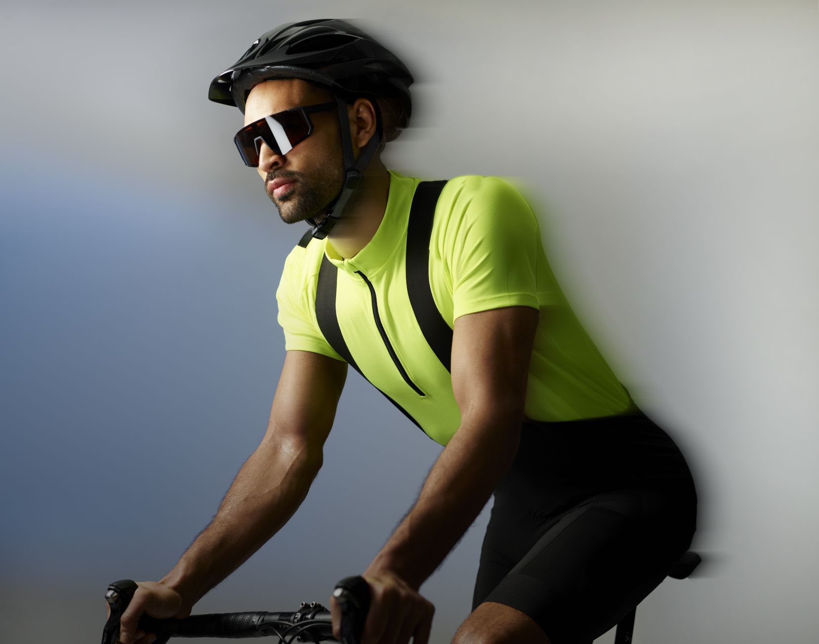 A man on a bike with motion blur effects