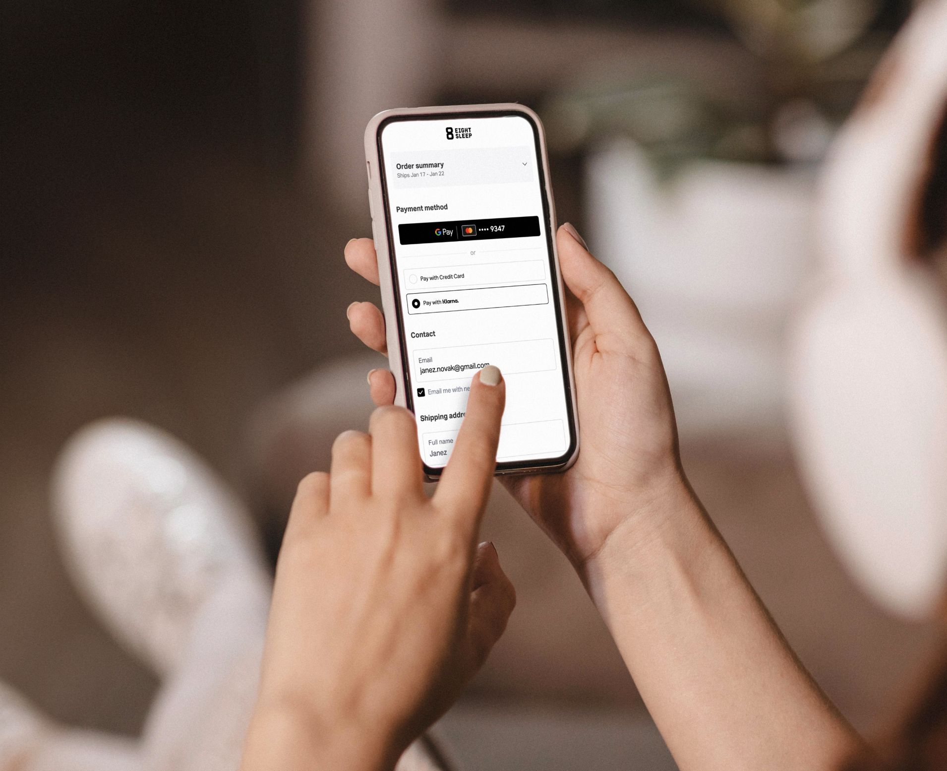 Person using phone to explore financing options