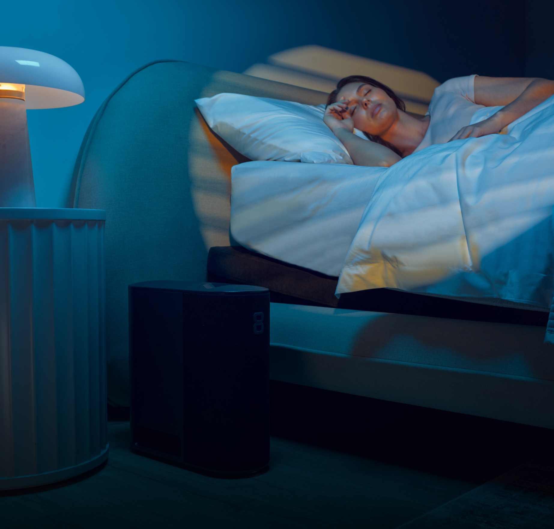 A woman sleeping on the Pod 4 Ultra.