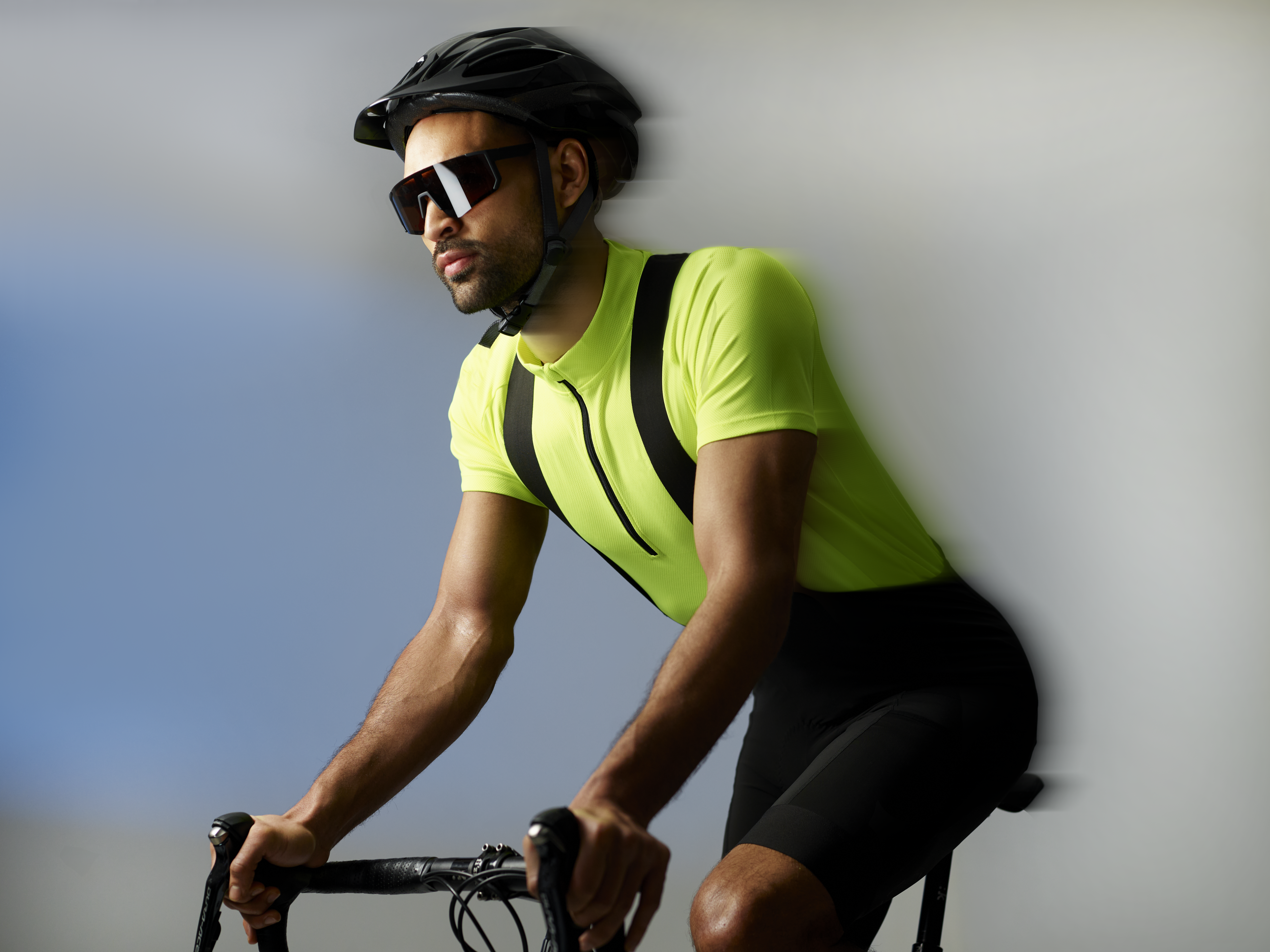 A man on a bike with motion blur effects